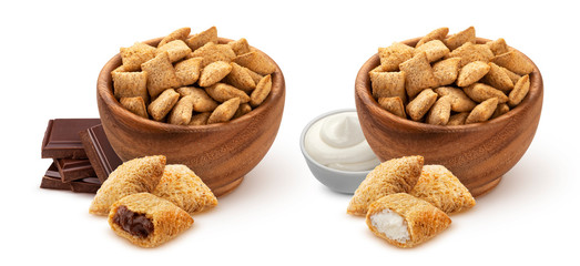 Sweet corn pads with chocolate and milk filling in wooden bowl isolated on white background