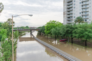 Red car swamped by high water near downtown Houston, Texas
