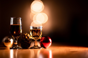 Glasses of Bourbon Whiskey with Christmas Ornaments