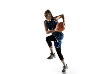 Young caucasian female basketball player of team in action, motion in jump isolated on white background. Concept of sport, movement, energy and dynamic, healthy lifestyle. Training, practicing.