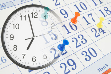Clock and calendar with push pins, time and appointment concept 