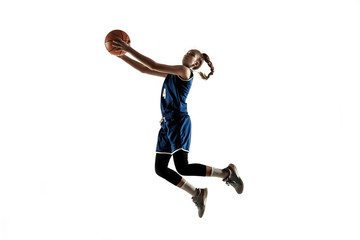Young caucasian female basketball player of team in action, motion in jump isolated on white background. Concept of sport, movement, energy and dynamic, healthy lifestyle. Training, practicing.