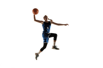Young caucasian female basketball player of team in action, motion in jump isolated on white background. Concept of sport, movement, energy and dynamic, healthy lifestyle. Training, practicing. © master1305