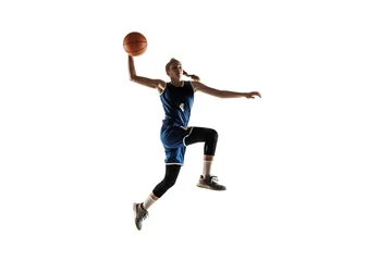 Foto auf Acrylglas Young caucasian female basketball player of team in action, motion in jump isolated on white background. Concept of sport, movement, energy and dynamic, healthy lifestyle. Training, practicing. © master1305