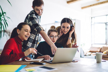 Sceptic man helping classmates with homework