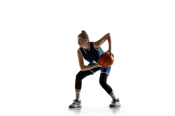 Young caucasian female basketball player of team in action, motion in run isolated on white...