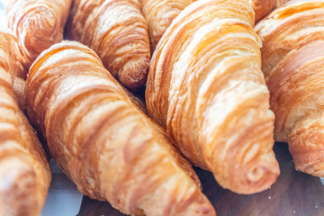 Freshly baked croissant. breakfast bread. French pastry. food and drink sandwich bread