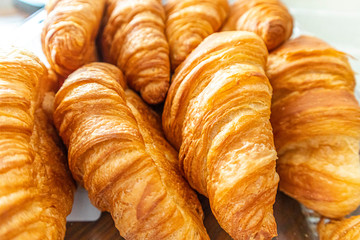 Freshly baked croissant. breakfast bread. French pastry. food and drink sandwich bread
