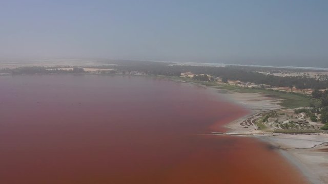 Aerial view of the pink Lake Retba or Lac Rose in Senegal. Photo made by drone from above. Africa Natural Landscape.