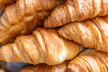 Freshly baked croissant. breakfast bread. French pastry. food and drink sandwich bread