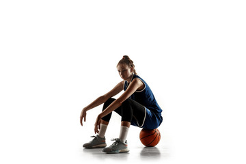 Young caucasian female basketball player of team posing confident isolated on white background....