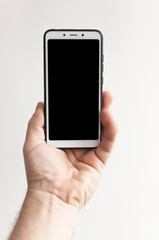 close-up hand holding phone blank screen
