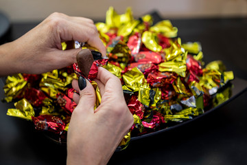 Christmas individually wrapped chocolate fondant in a bowl.