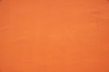 Surface of orange plaster on the wall