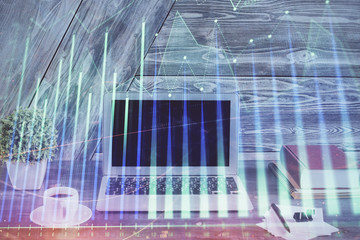 Multi exposure of forex graph and work space with computer. Concept of international online trading.