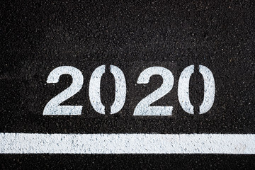 Asphalt background with 2020 new year lettering.
