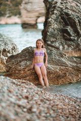 Cute little girl at beach during summer vacation