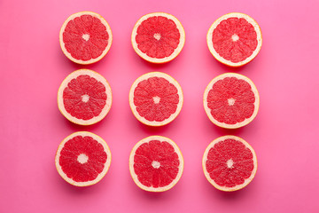Fresh cut grapefruit on color background