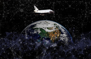 space ship shuttle on the earth orbit in atmosphere. flying in outer space. Elements of this image...