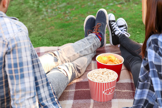 Young Couple Watching Movie In Outdoor Cinema