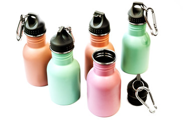 A set of safe, reusable stainless steel water bottles isolated white background