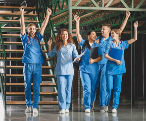 Group of happy students in corridor of medical university