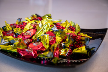 Christmas individually wrapped chocolate fondant in a bowl.