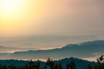 Obraz premium Morning mist in the mountains during sunrise
