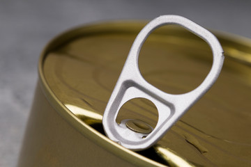 an opened tin can close up