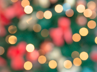 Abstract blurred golden Christmas light on tree with other ornaments. Christmas and New Year holidays concept.