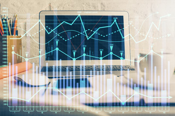 Financial market graph hologram and personal computer on background. Multi exposure. Concept of forex.