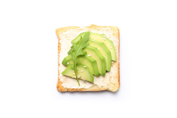Toast with butter, avocado, arugula and sesame isolated on white background