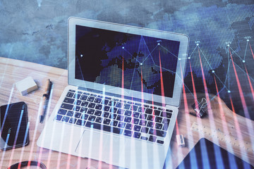 Multi exposure of graph and financial info and work space with computer background. Concept of...