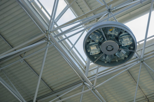 modern round lamp on the ceiling of an industrial building
