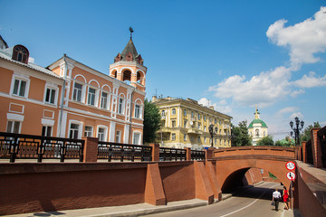 Naklejka premium Old stone bridge of red bricks in old historic city street of Voronezh in Russia.