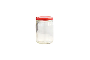 Empty glass jar with a red lid.