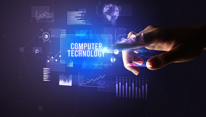 Hand touching COMPUTER TECHNOLOGY inscription, new business technology concept