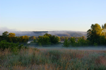 Fototapeta na wymiar Blurred image of a beautiful landscape. Abstract nature background. Nature, fog, landscape concept.