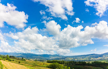 Fototapeta na wymiar mountain and blue sky and very nice clouds.