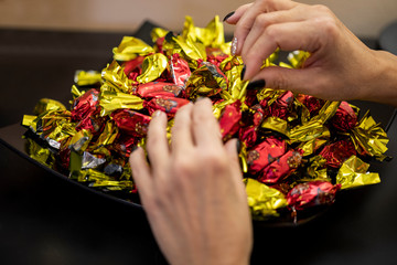 Christmas individually wrapped chocolate fondant in a bowl.