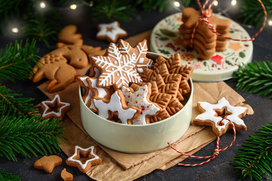 Christmas gingerbread stars cookies in a can on a dark background. Close-up. Selective focus.