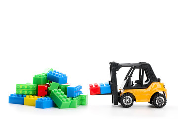 Fototapeta premium Plastic toy block over white background