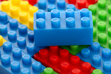 Plastic toy block over white background