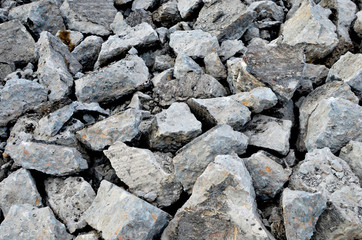 Hardcore waste recycling. Broken concrete slabs at construction site. oncrete rubble from demolition at landfill.  Recycling and reuse crushed concrete rubble, asphalt, building material, blocks.