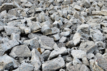Hardcore waste recycling. Broken concrete slabs at construction site. oncrete rubble from demolition at landfill.  Recycling and reuse crushed concrete rubble, asphalt, building material, blocks.