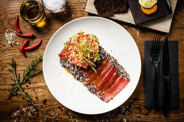 Tuna sashimi served on a plate in restaurant
