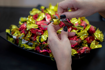 Christmas individually wrapped chocolate fondant in a bowl.