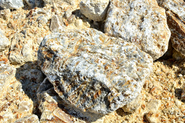 Natural gray gypsum stone. Close up image of stones with black and white. Industrial mining area. Limestone mining, quarry - Image