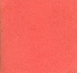 Old red paper texture. Rough faded surface. Blank retro page. Empty place for text. Perfect for background and vintage style design.