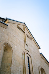 Fototapeta na wymiar modern christian church with a cross on the wall in Georgia